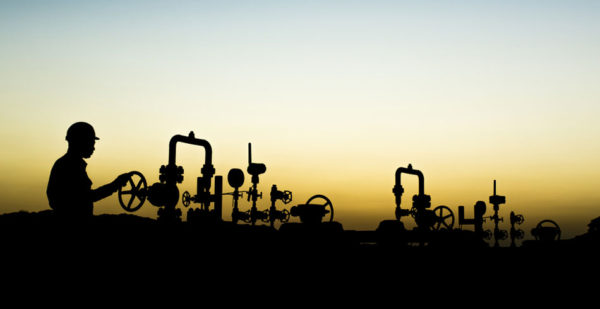 Silhouette of gas plant and worker (strike hancock)