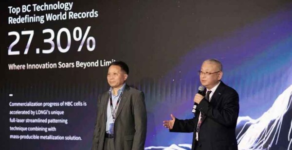 LONGi founder and president Li Zhenguo and Chief Scientist Dr Xu Xixiang unveiling the company's record-breaking 27.3% efficient silicon solar cell