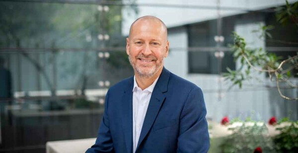 CSIRO CEO Dr Doug Hilton wearing a suit and smiling