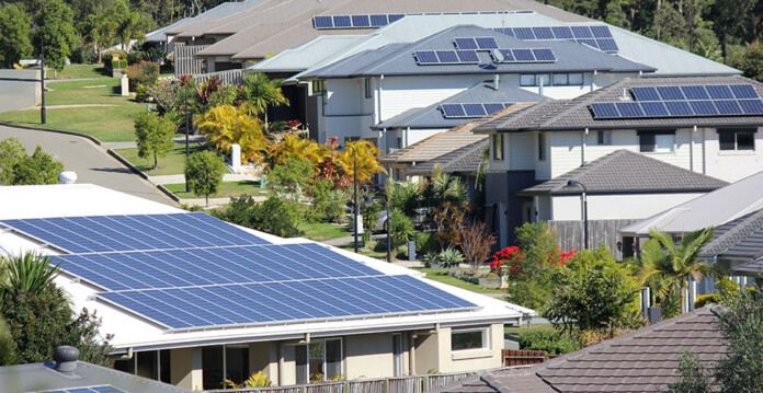 Suburban homes with solar panels installed on the rooftops (flexible services)