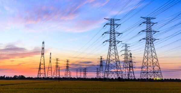 Transmission towers against sunset (ausnet community fund)